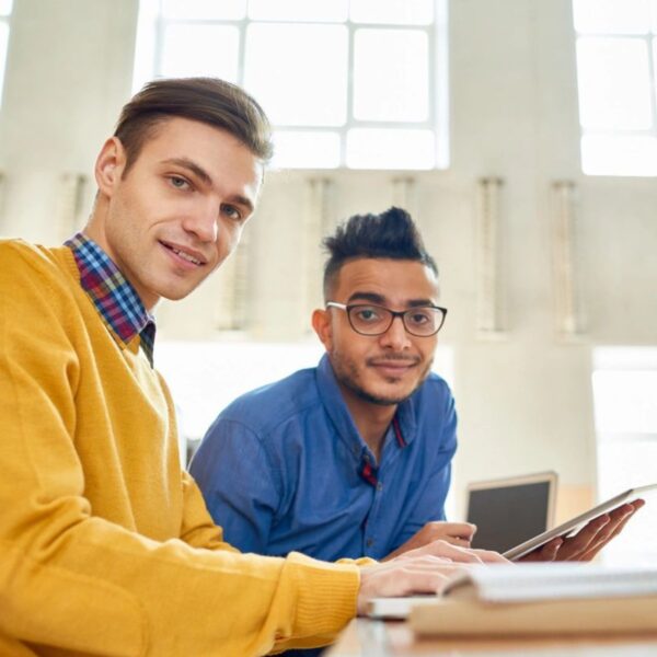 Two Cheerful Students Looking at Camera